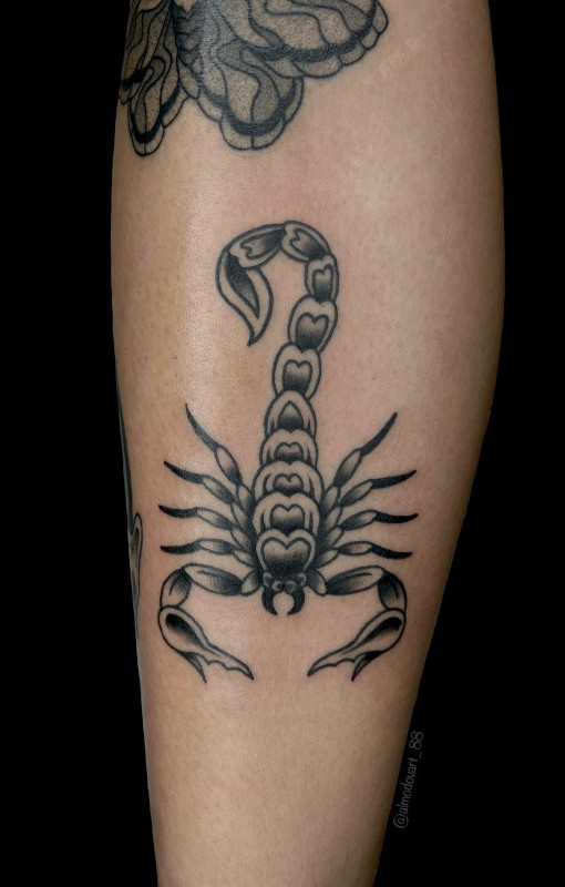 Black and grey fine line calf tattoo of a scorpion tattooed by Sacred Mandala Studio artist Lita Almodovar.